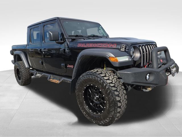 2021 Jeep Gladiator Rubicon in Black Clearcoat — front three-quarter view